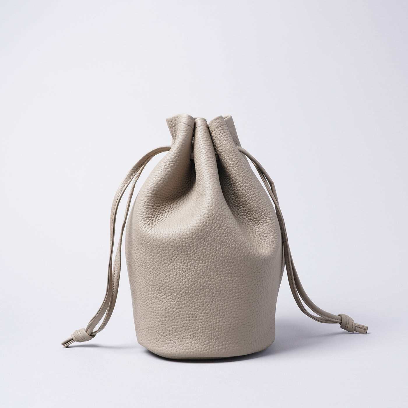 <LEZALI> Embossed Leather Draw String Mini Bag / Gold